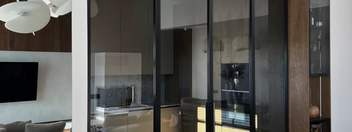 Kitchen partition with gray tinted glass